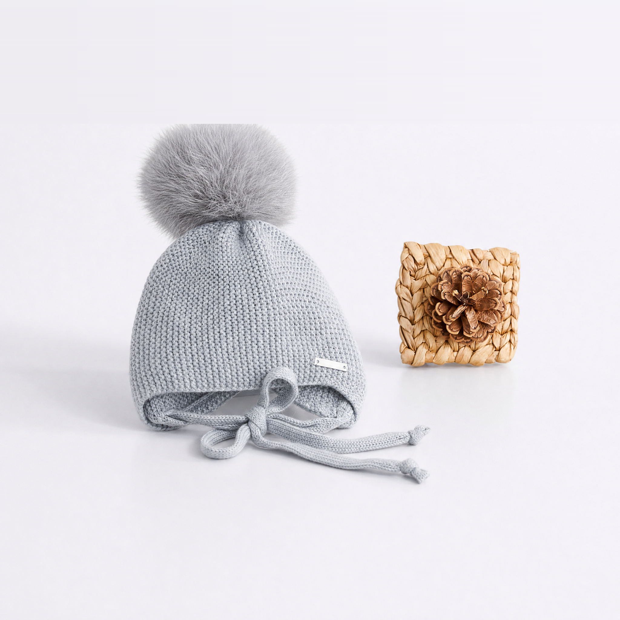GORRO OREJERO-AÑADIR POMPON GRIS