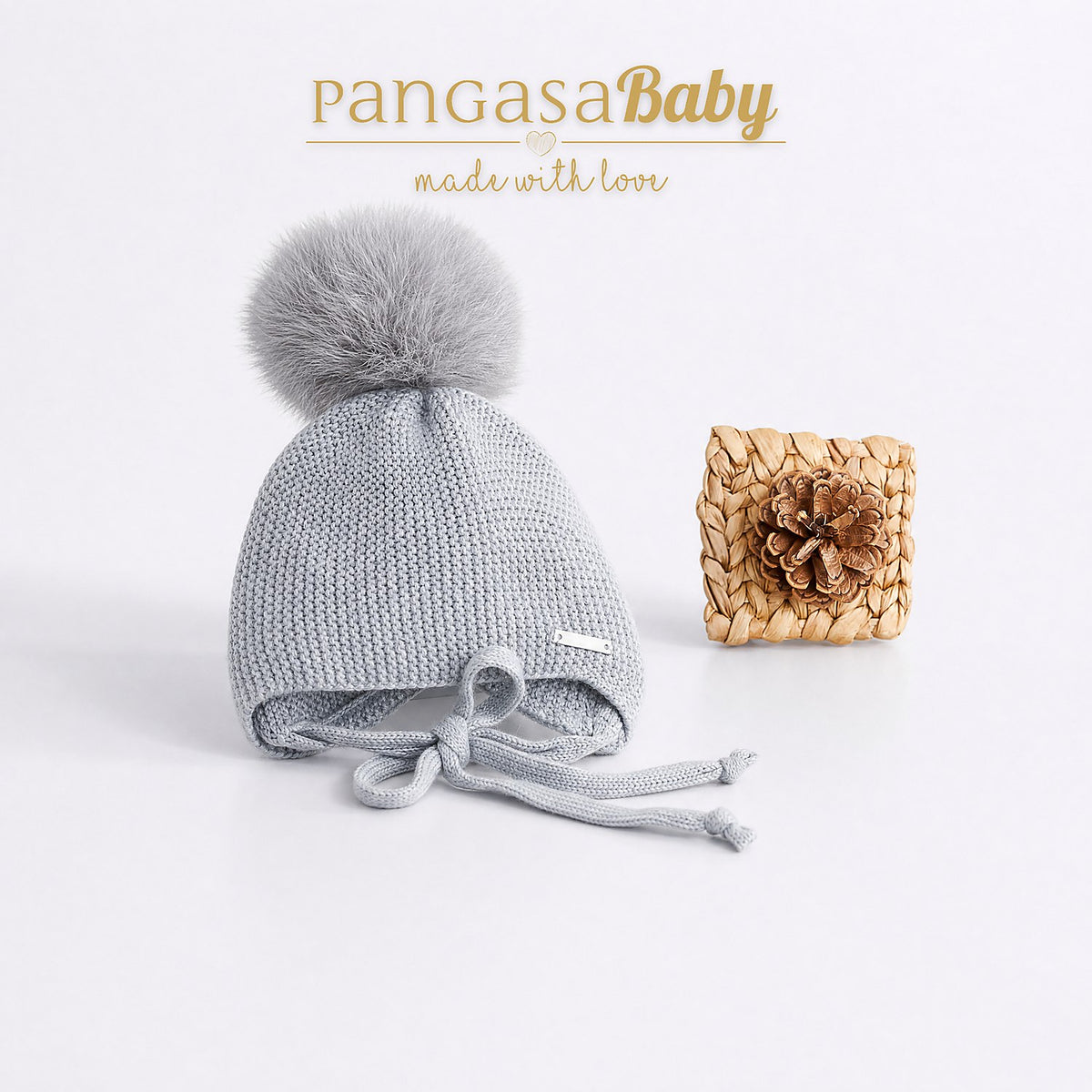 GORRO OREJERO-AÑADIR POMPON GRIS